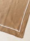 Foulard vintage Yves Saint Laurent in seta biscotto con profili e logo bianchi