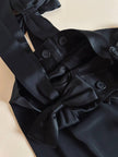 Pantalone nero con bretelle e maxi fiocchi in raso “Moschino Cheap and Chic”