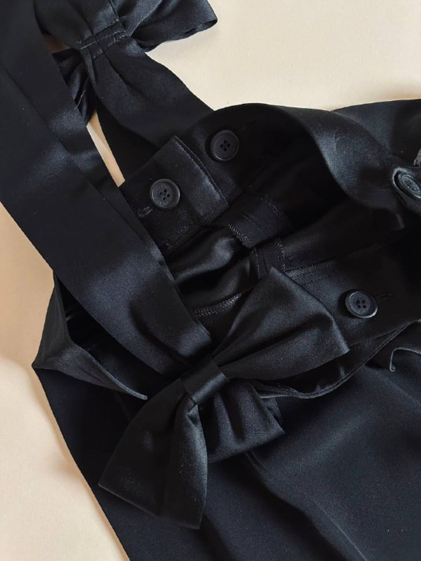 Pantalone nero con bretelle e maxi fiocchi in raso “Moschino Cheap and Chic”