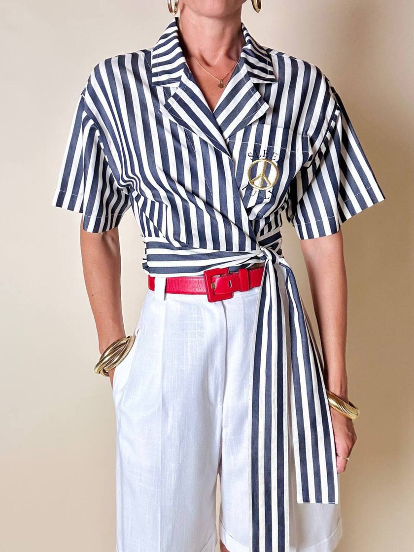 Moschino blue and white striped wrap blouse with embroidered peace symbol