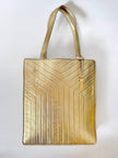 Bolso tote vintage Yves Saint Laurent de piel laminada dorada con diseño matelassé chevron