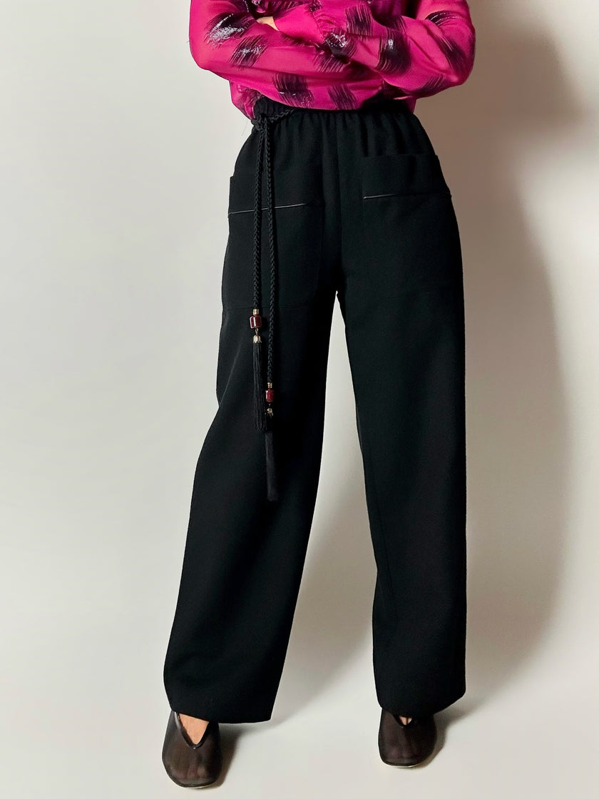 Pantaloni vintage Yves Saint Laurent Variation in lana nera a gamba ampia con tasche applicate