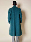 Cappotto doppiopetto in lana bouclé verde bosco con fodera firmata