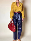 Borsa in pelle rosso bruciato con manici a treccia