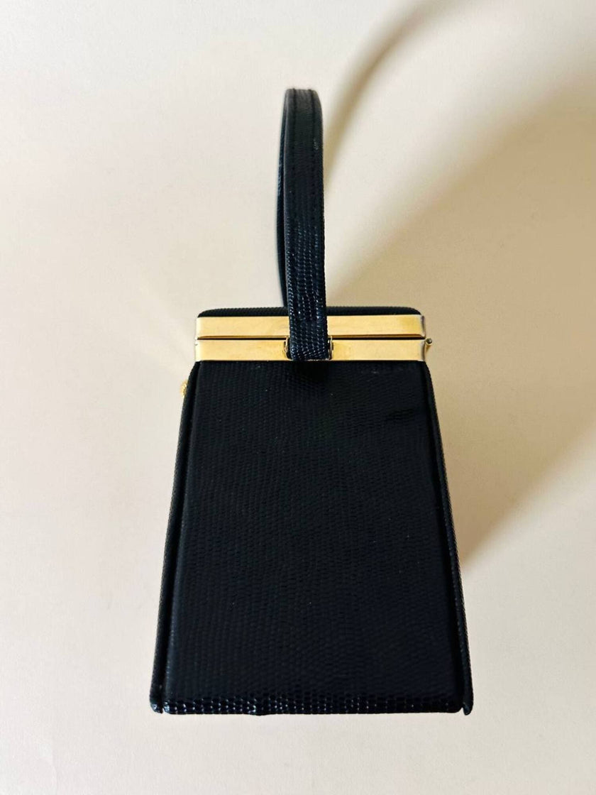 Mini bag a trapezio in ecopelle nera stampa lizard