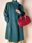 Cappotto doppiopetto in lana bouclé verde bosco con fodera firmata