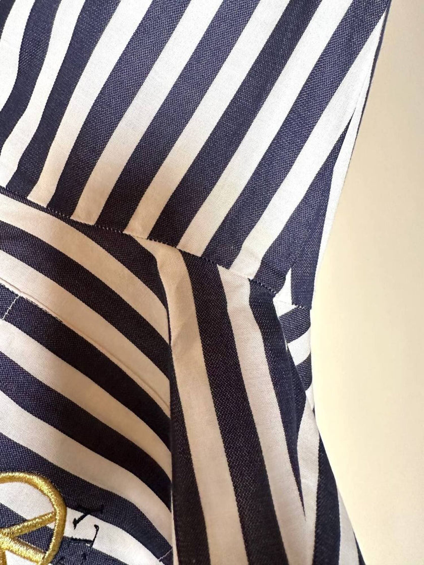 Moschino blue and white striped wrap blouse with embroidered peace symbol