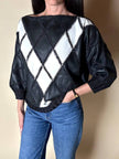 Blusa vintage in pelle nera e bianca patchwork con lavorazione crochet e maniche a pipistrello