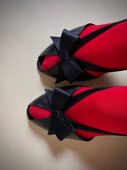 Sandali neri in pelle e raso con fiocco “Yves Saint Laurent”