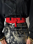 Cintura vintage rossa realizzata con intreccio di passamanerie e nappa couture