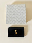 Portachiavi trifold Gucci in pelle nera con logo in metallo oro e scatola originale
