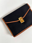Pochette vintage Celine modello a busta in canvas nero con profili in pelle tabacco