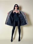 Collant vintage Yves Saint Laurent in lycra lucida nera con elastico logato