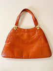 Borsa in pelle arancione zucca con doppi manici e hardware oro
