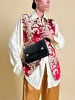 Borsa in pelle nera in stampa tejus 