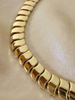 Collier dorato con moduli a onda