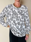 Blusa Yves Saint Laurent in tessuto jacquard bianco e nero fantasia Domino