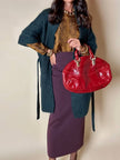Borsa in pelle rosso bruciato con manici a treccia