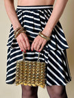 Mini bag gioiello a medaglie dorate