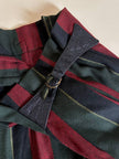 Pantalone a vita alta in lana jacquard a righe verticali con cinturini in pelle nera