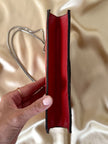 Borsa rossa in coccodrillo con borchie argento e tracolla metallica “Nicolette”