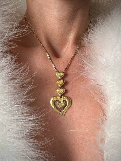 Collana dorata con ciondolo pendente a cuoricini “Yves Saint Laurent”