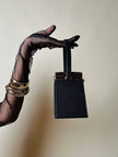 Mini bag a trapezio in ecopelle nera stampa lizard