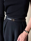 Cintura vintage Yves Saint Laurent in pelle nera con fibbia geometrica oro con logo YSL