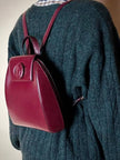Sac à dos Must de Cartier en cuir bordeaux avec finitions dorées