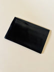 Pochette vintage Yves Saint Laurent in pelle nera con greca logata in rilievo