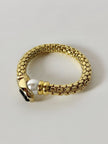 Bracciale vintage in metallo dorato con perla onice nero e cristalli
