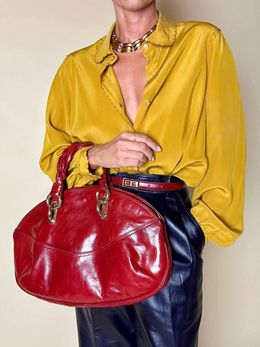 Borsa in pelle rosso bruciato con manici a treccia