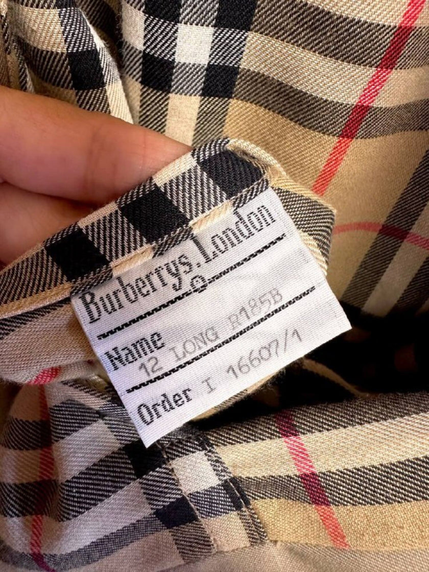Vintage Burberry’s beige quill gabardine trench coat with matching belt and Check lining