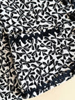 Giacca in cotone piquet bianco con fantasia a fiocchi neri “Yves Saint Laurent”