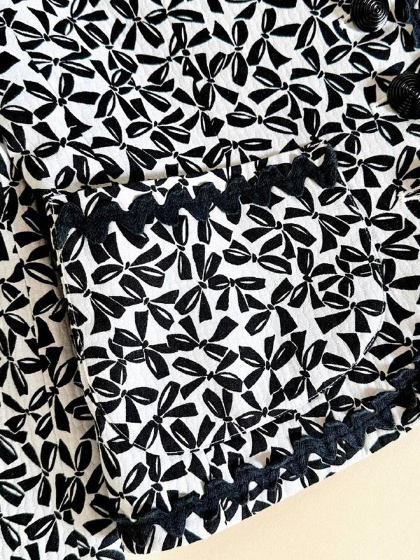 Giacca in cotone piquet bianco con fantasia a fiocchi neri “Yves Saint Laurent”