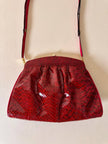 Pochette in whips rossa con tracolla regolabile