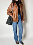 Secchiello vintage Yves Saint Laurent in tessuto nero millerighe con riporti in pelle