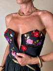 Bustier in cotone nero ricamato con fiori e paillettes e piccole coccarde multicolor “Giorgio Kauten”
