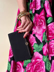 Mini pochette in tessuto nero con chiusura logata color oro “Gucci”
