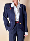 Spilla Yves Saint Laurent a forma di salvagente in metallo oro e smalto rosso e blu