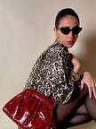 Pochette in whips rossa con tracolla regolabile