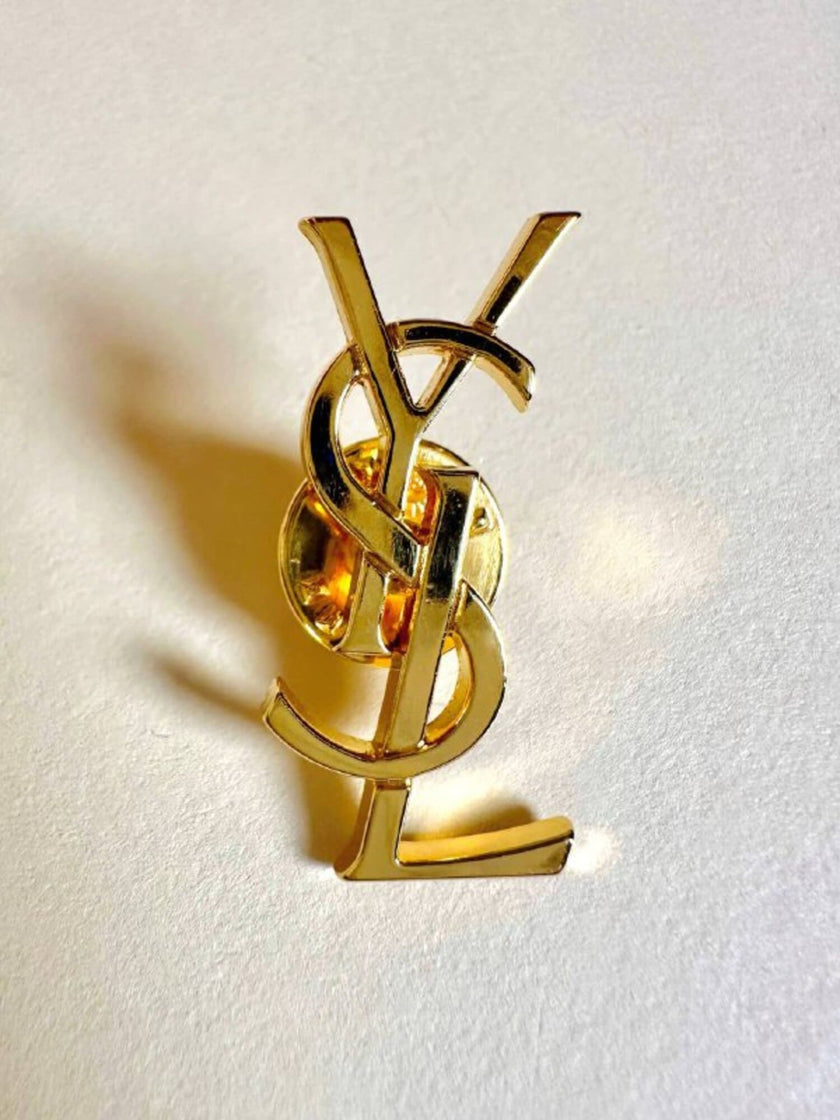 Spilla logo Yves Saint Laurent color oro