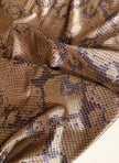 Collant Yves Saint Laurent in lycra fantasia pitone nei toni del beige bronzo e marrone