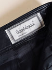 Minigonna a vita alta in pelle nera “Gianni Versace”