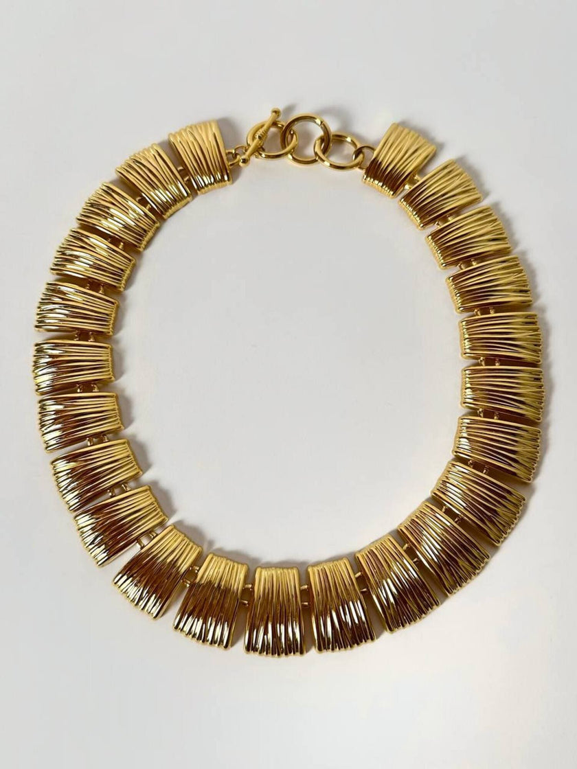 Collier vintage oro con elementi geometrici striati