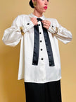 Camicia in raso bianco con fiocco nero “Yves Saint Laurent”
