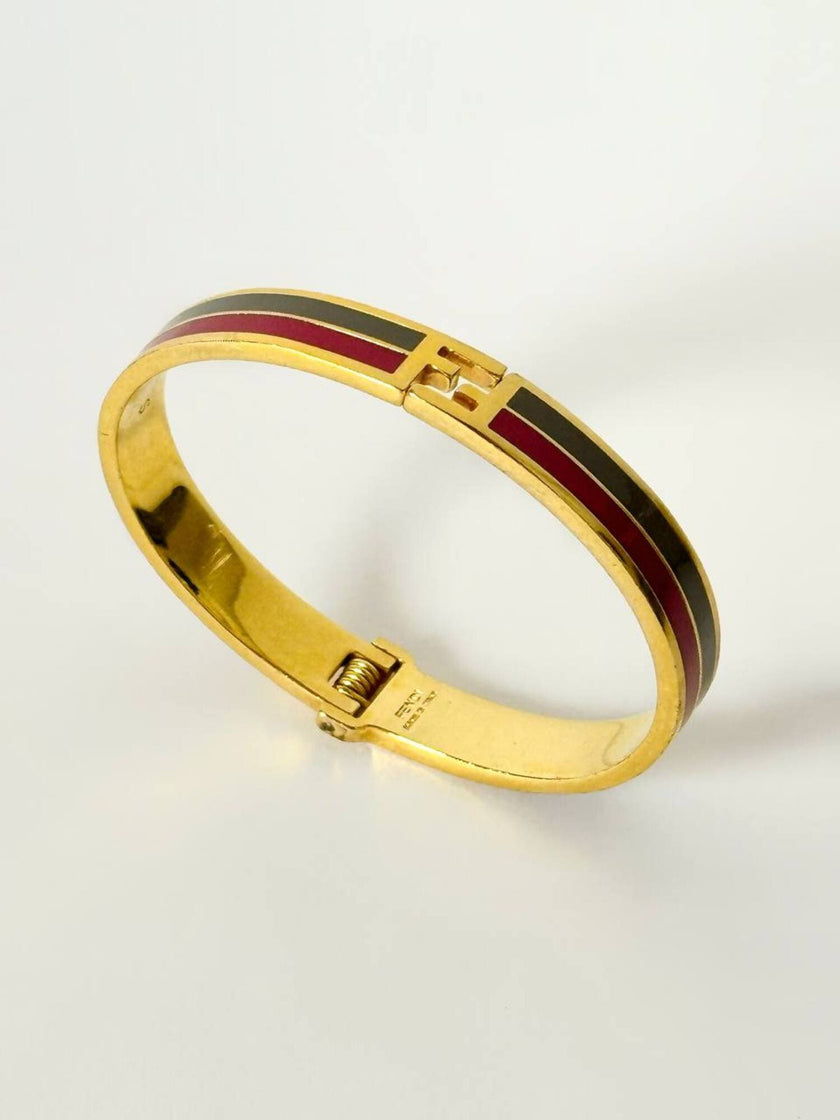 Bracciale vintage Fendi in metallo oro rifinito con smaltato grigio e rosso
