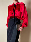 Clutch gioiello in seta nera con armatura di perline dorate “Rodo”