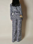 Jumpsuit in seta fantasia zebrata con maxi fiocco al collo