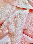 Wrap dress in raso rosa con rose bianche floccate